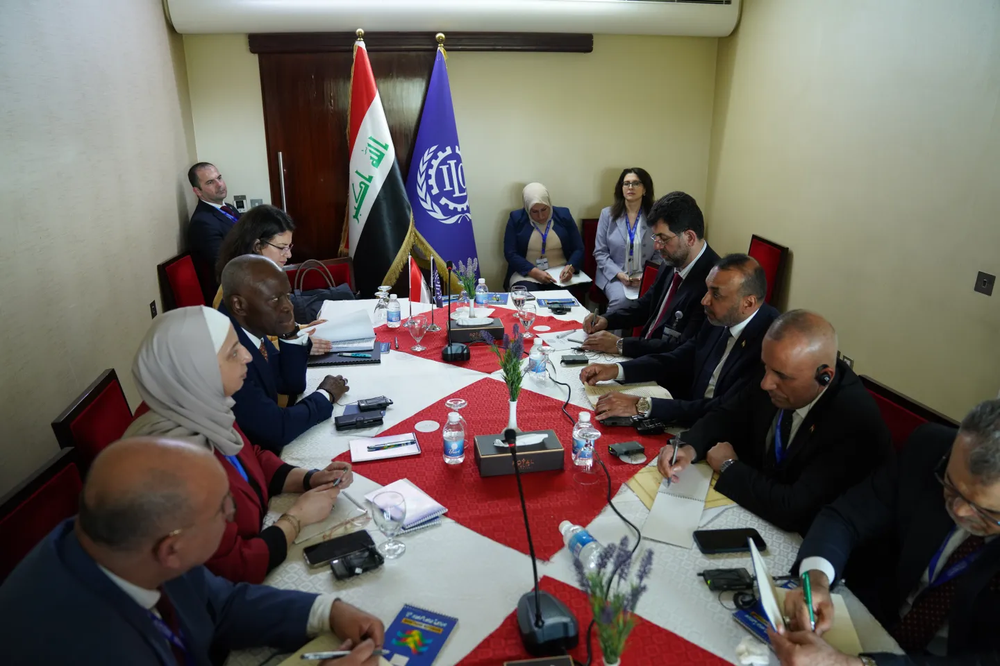 a group of people in a meeting