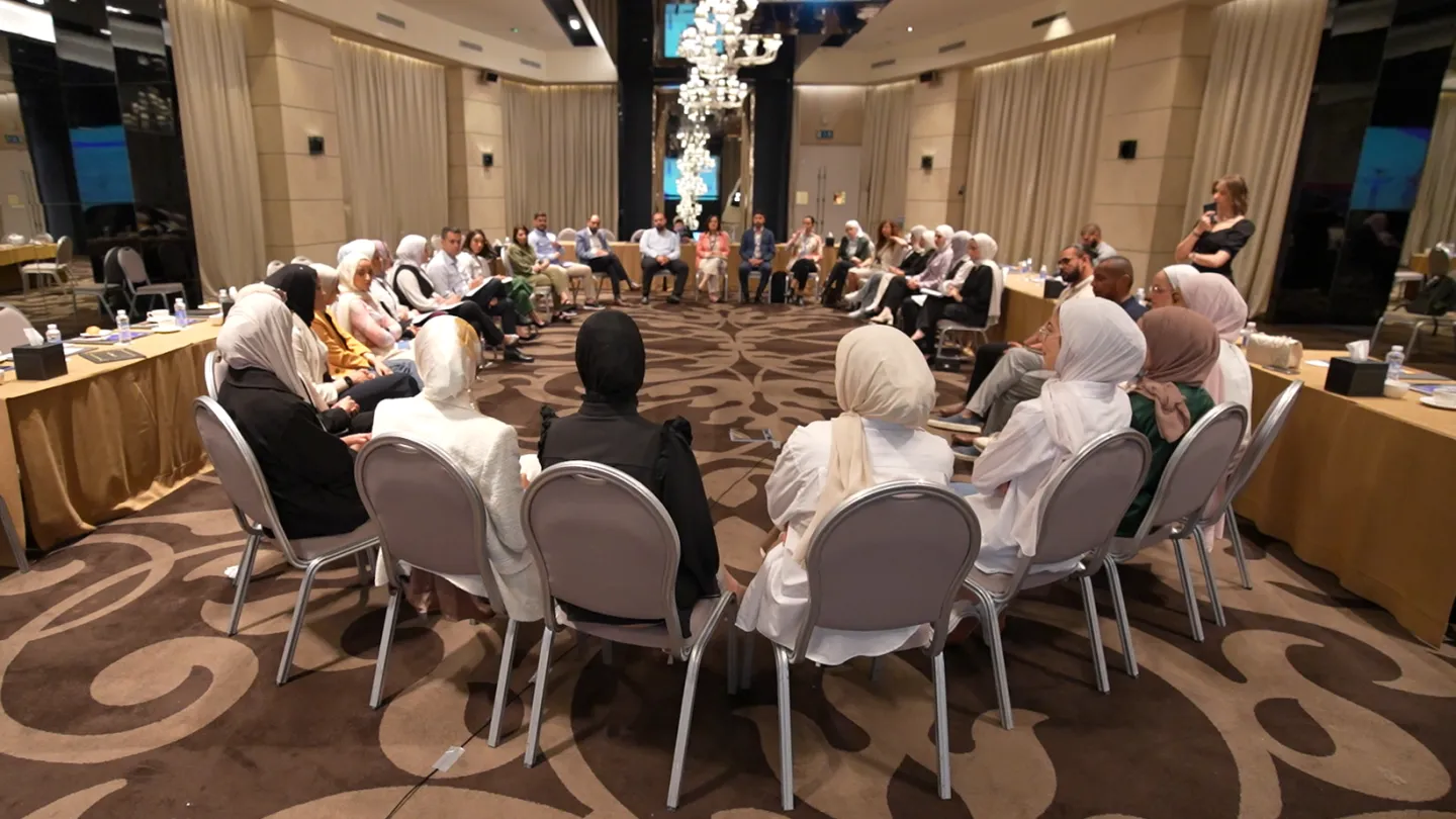 people sitting in a round circle.
