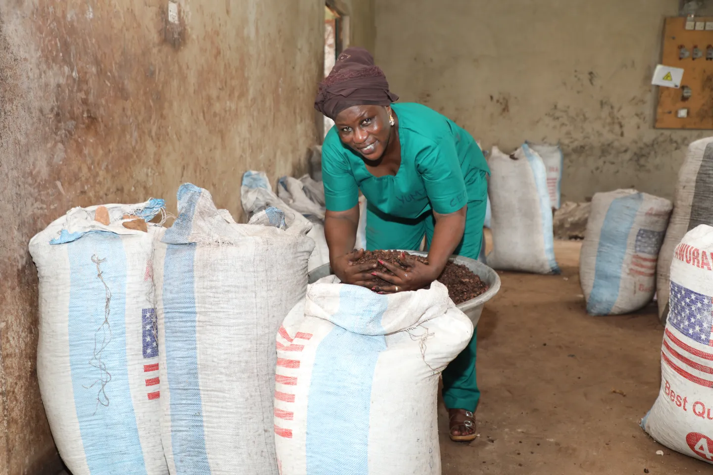 Image of Zakaria Adama Lacera, CEO of Yumzaa Enterprises, a shea processing and soap business. Zakaria is in the process of formalizing her business. She is seen in the image at work.