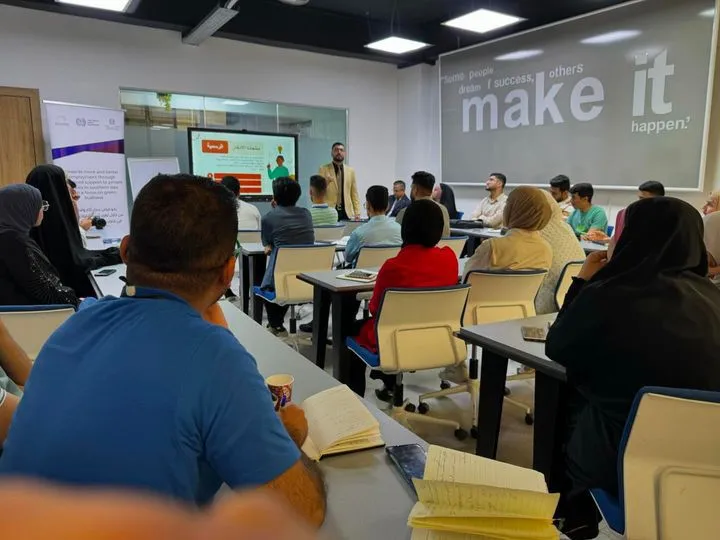 a group of students attending a training in a class