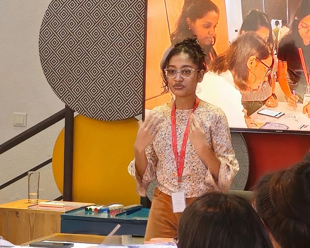 A young woman entrepreneur presents her business idea