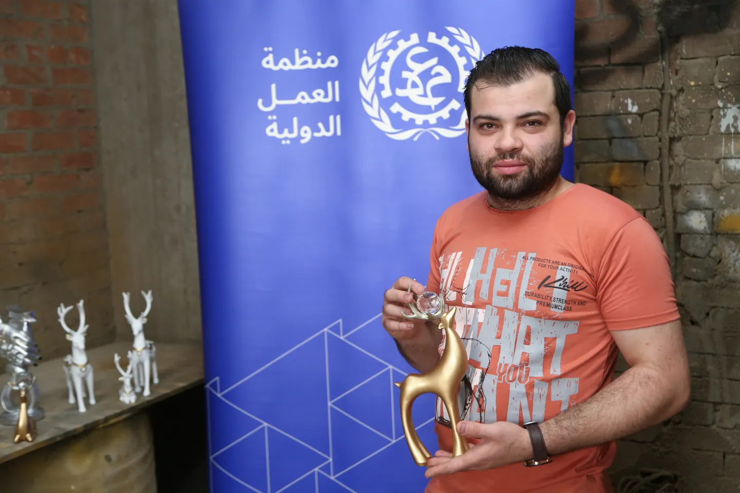 artisan holding a decorative product in hand