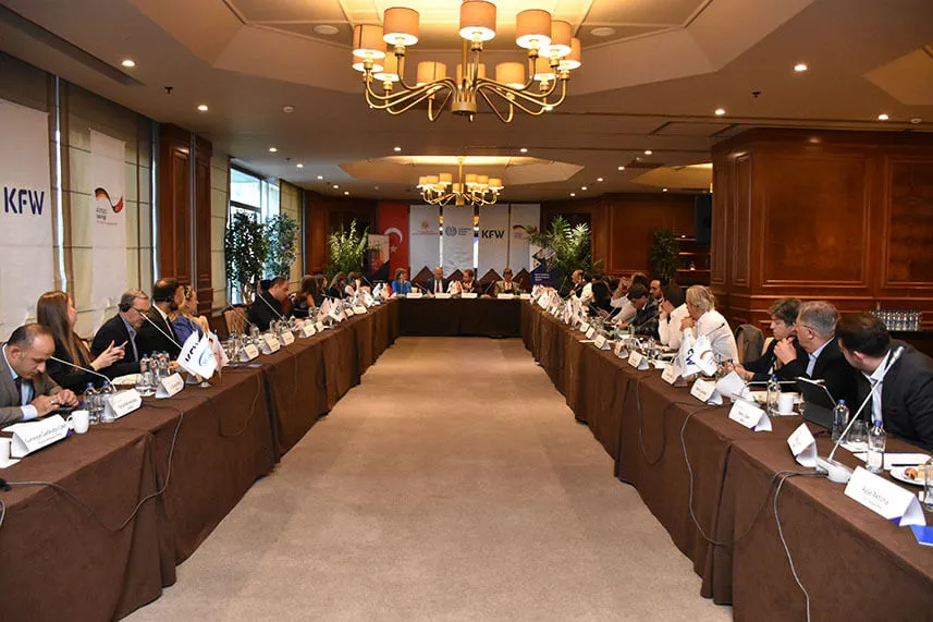 Advisory Board meeting participants sitting at table during discussions in Turkiye