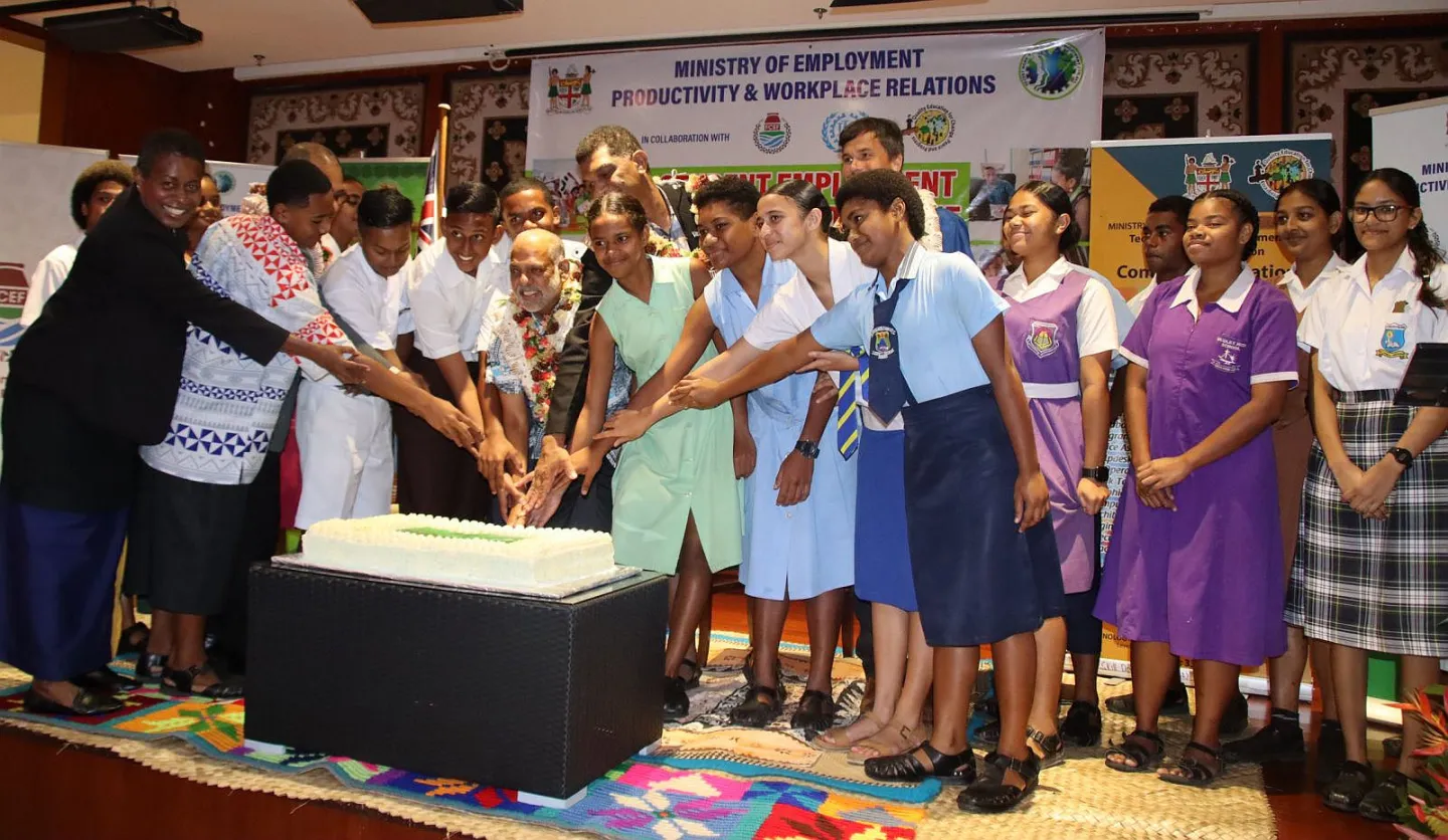 Cutting the cake to celebrate the launch of the Student Employment Exposure Program