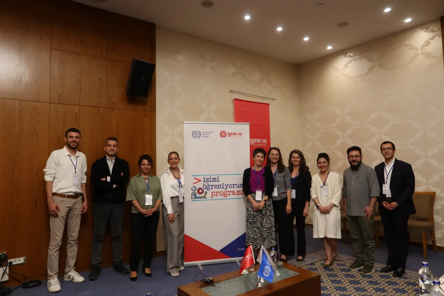 Training participants lined up next to project banner, in Izmir, Turkiye