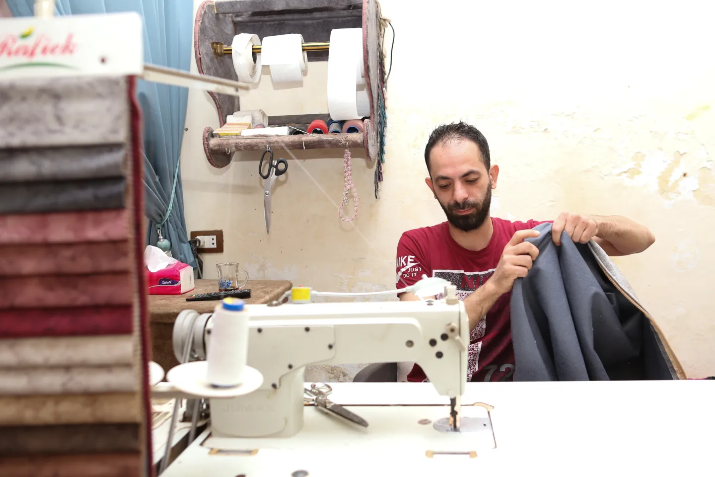 man stitching