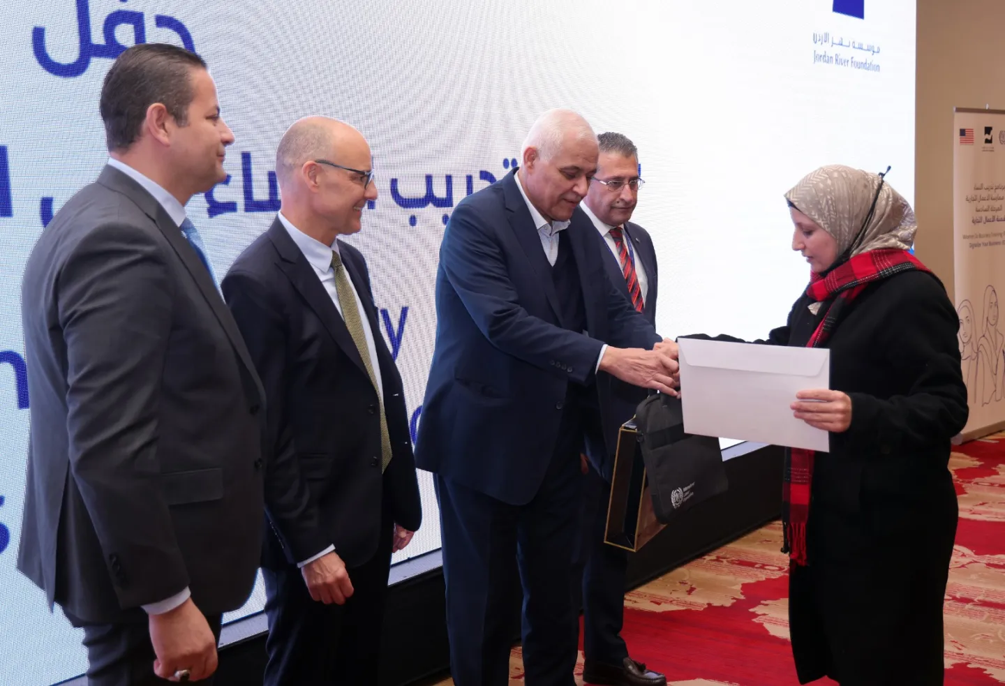 a woman receiving a certificate