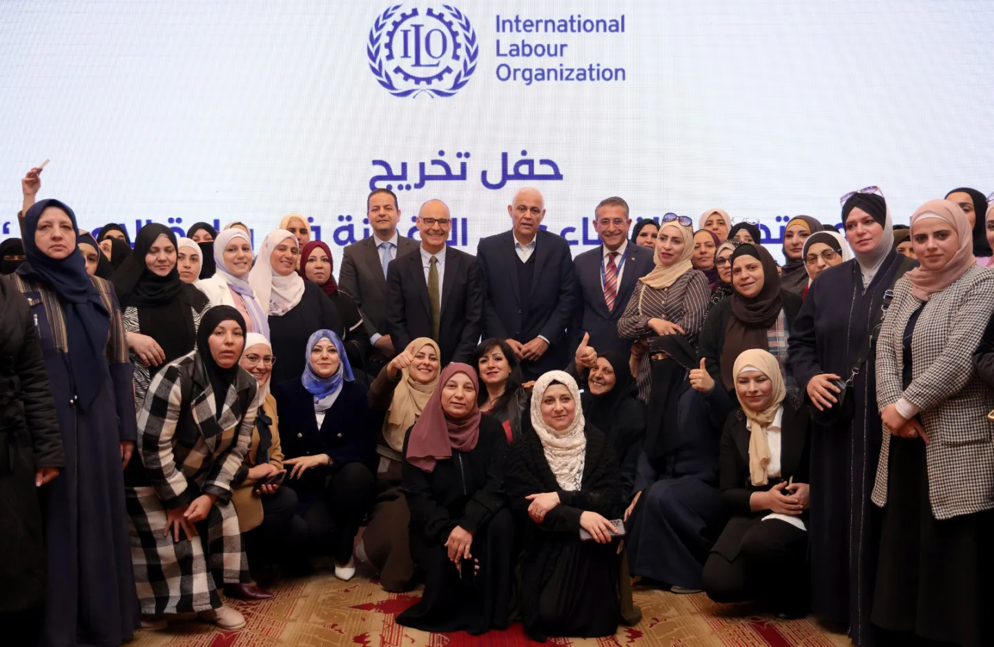 a group picture in a graduation ceremony