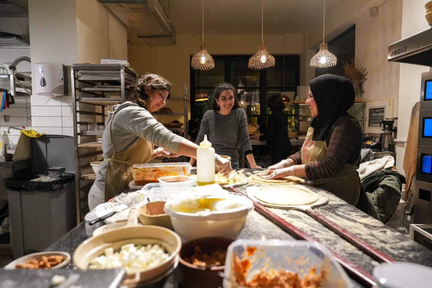 women discussing inside bakery