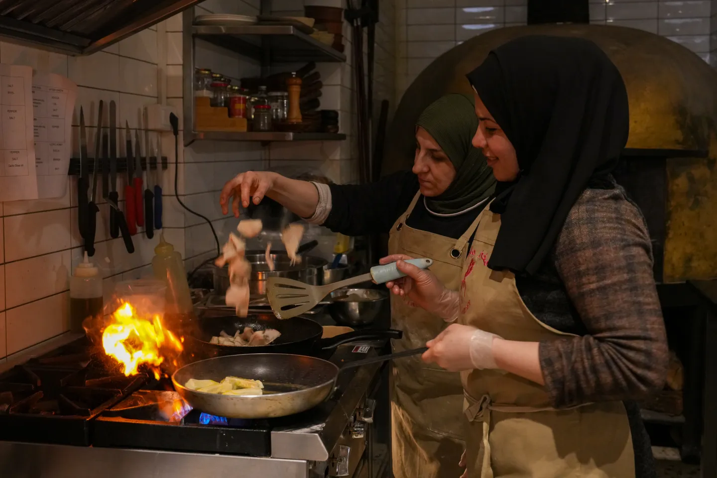 women cooking inside a bakery