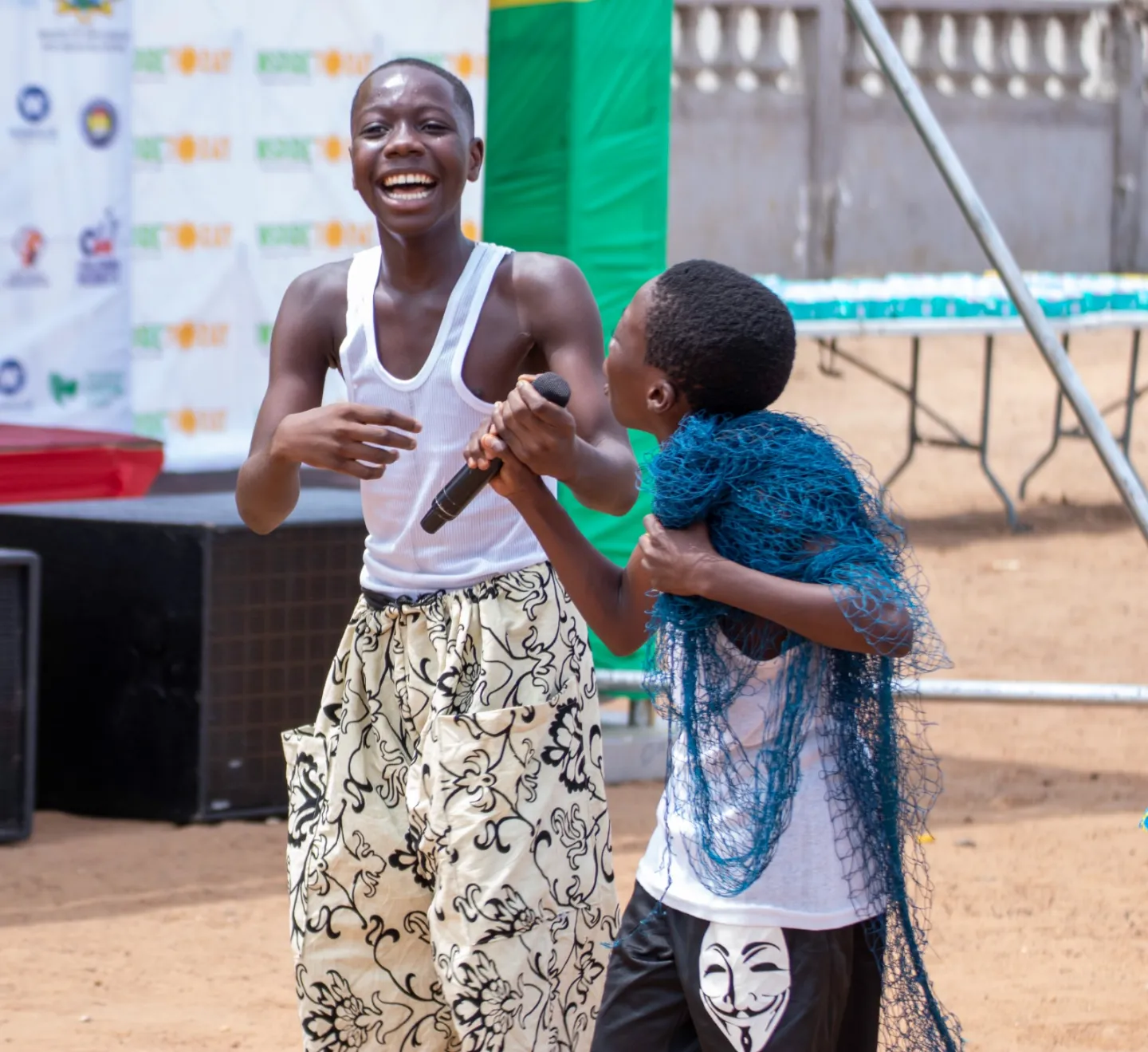 Children walking with a mic laugh 
