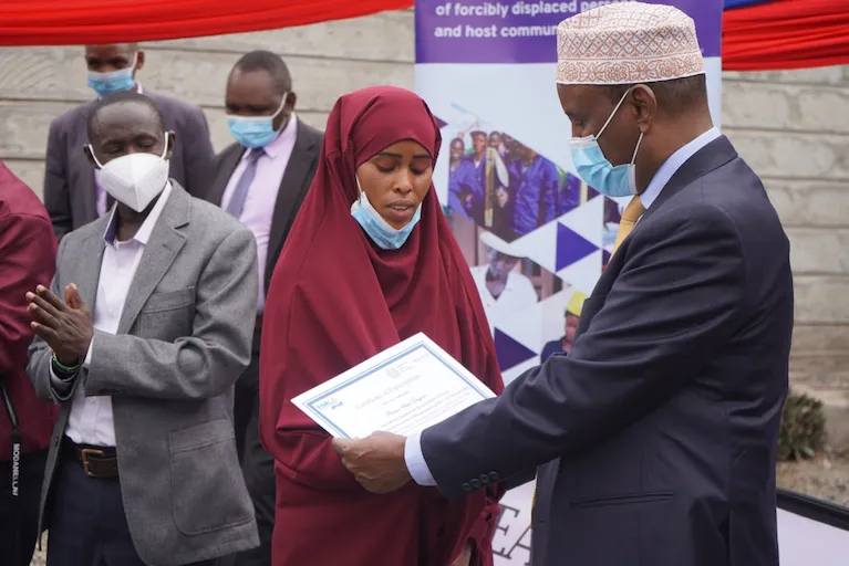 woman receiving certificate