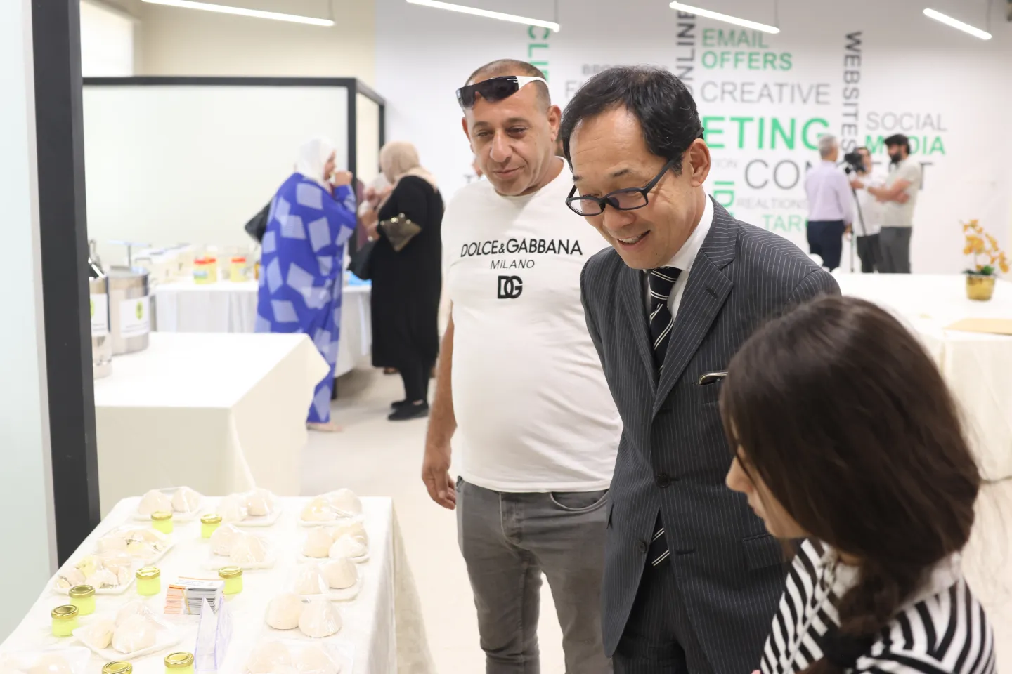 Japanese ambassador checking the produce of exhibitors