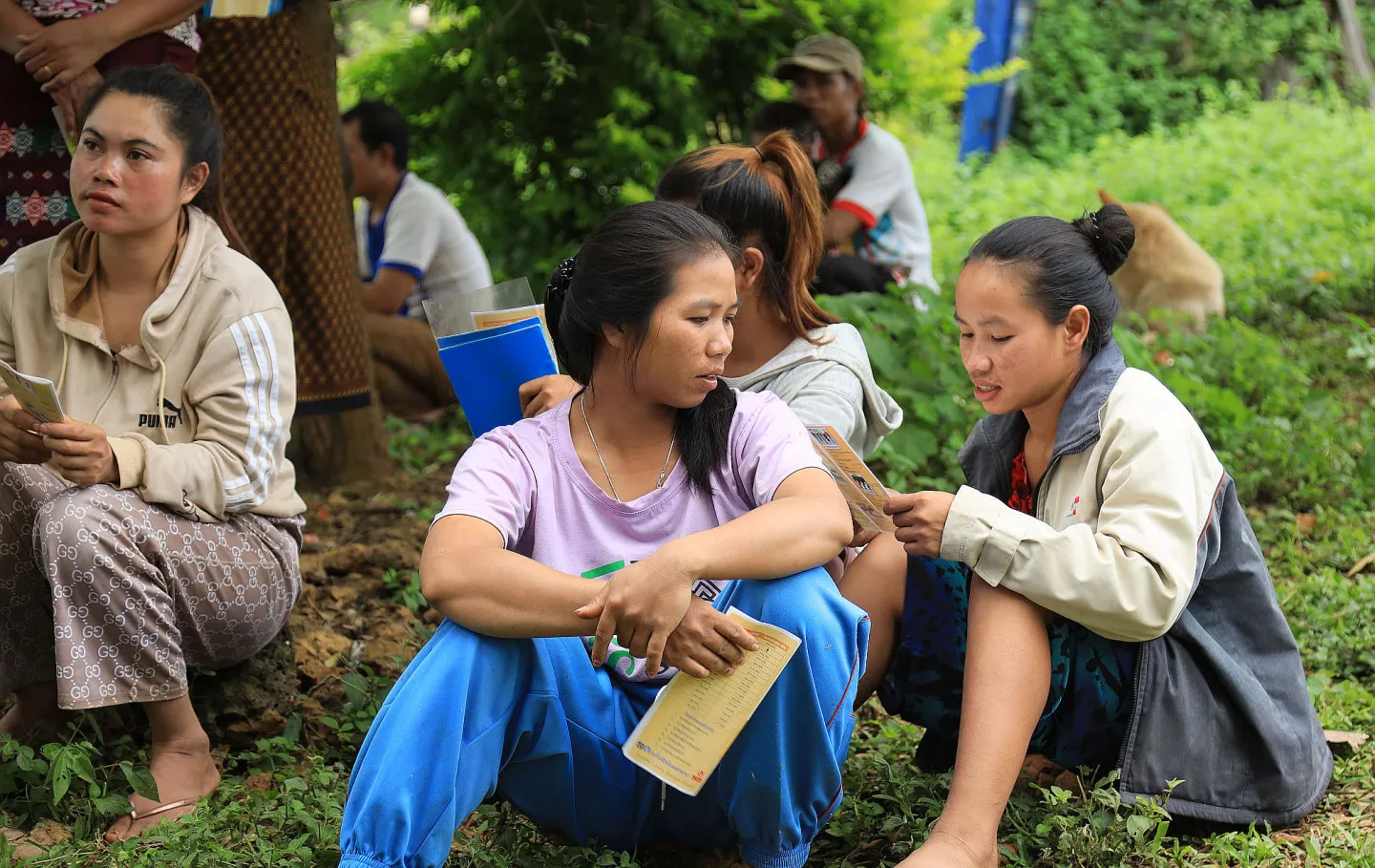 Woman farmers in Kokpung Neua village discuss the benefits of registering with the National Social Security Fund, Lao People's Democratic Republic