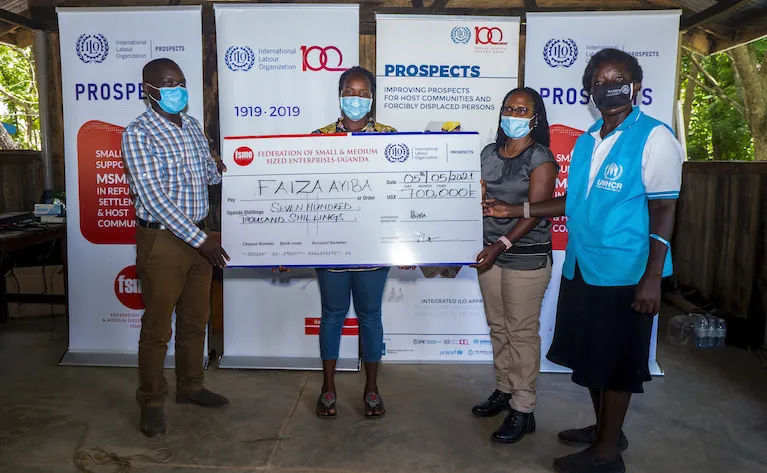 grant being handover to beneficiary
