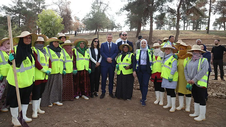 Workers and stakeholders at the afforestation site. 