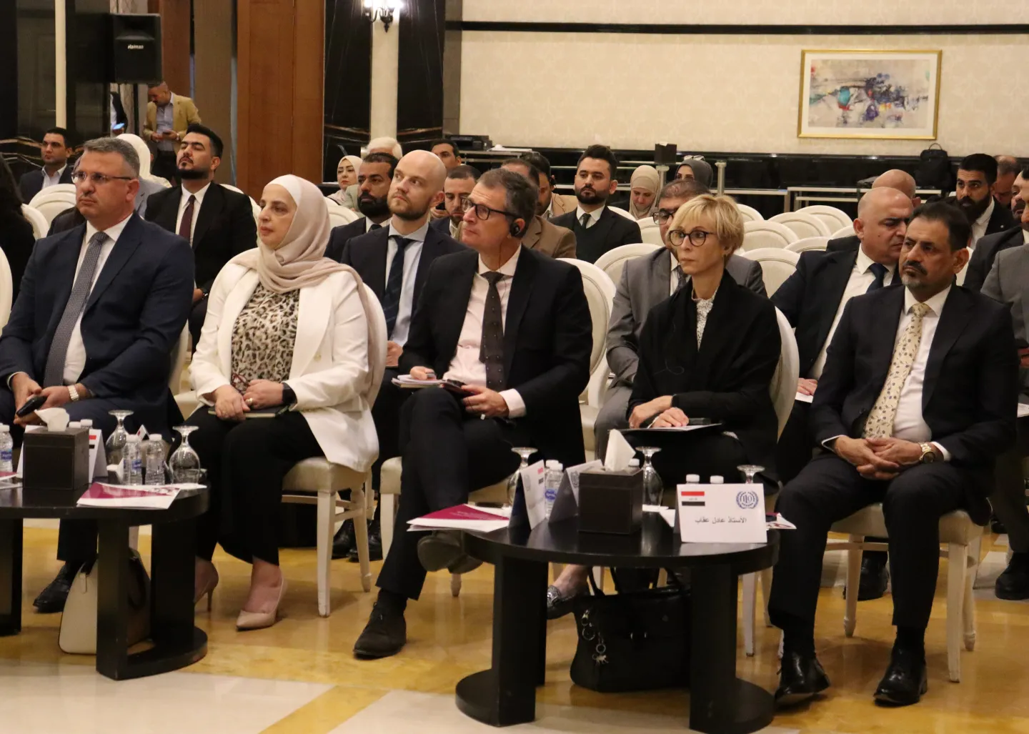 people at a conference in iraq