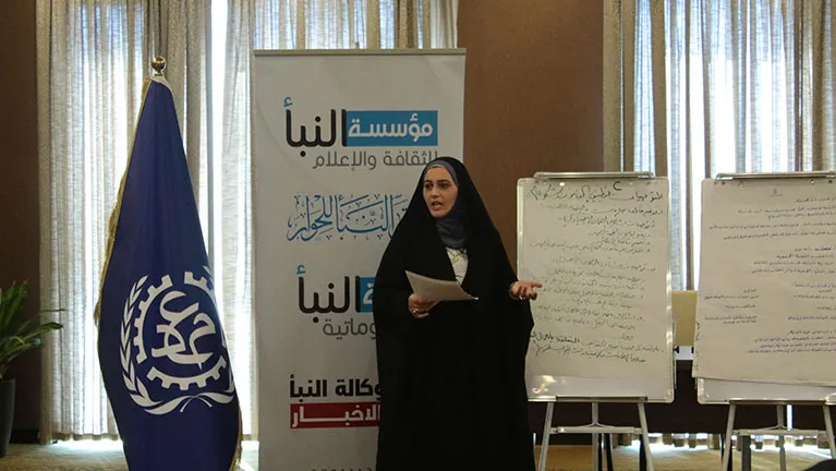 woman speaking at a conference