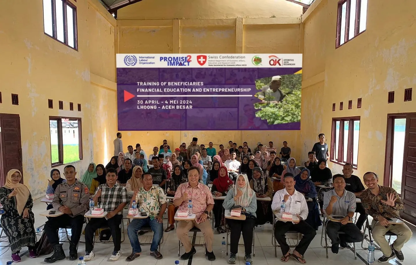 A group photo of trainers and participants of the ILO financial training programme in Aceh.