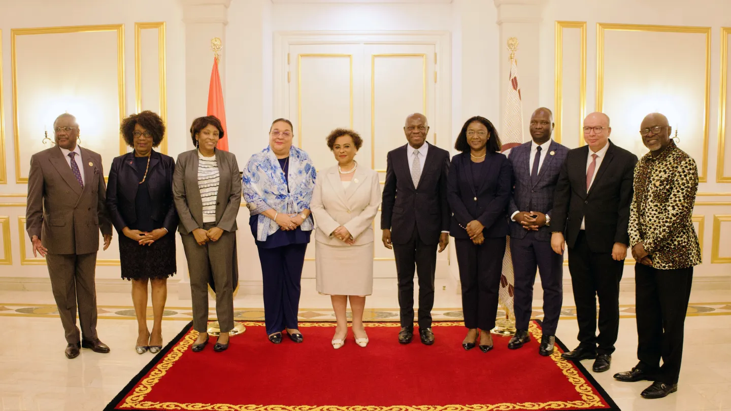 ILO Director-General Gilbert F. Houngbo stands with the President of the National Assembly, Carolina Cerqueira, ILO Country Office Director Nteba Soumano, and parliamentary advisors