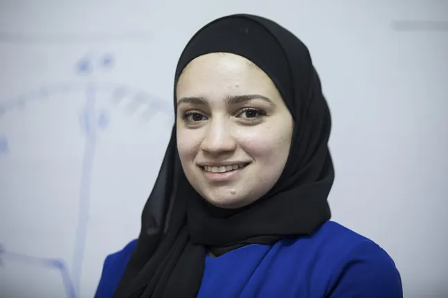 A woman posing for camera