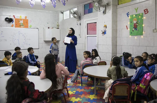 woman teacher and kids