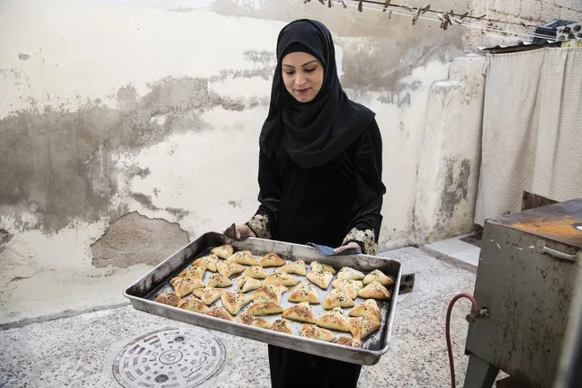 Woman showing her baked products