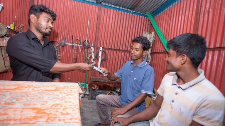 Shahadat with the apprentices at his workplace