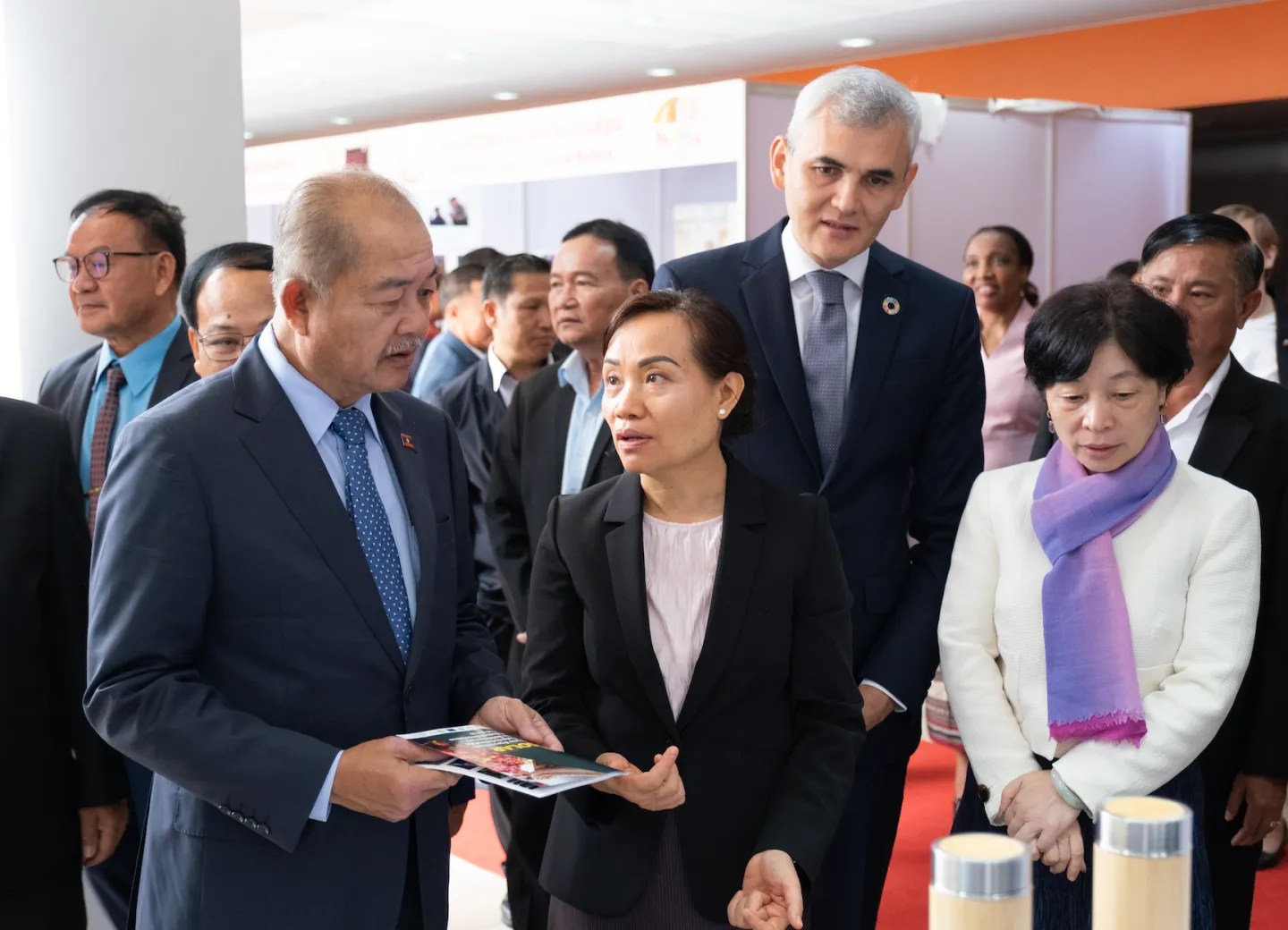 H.E. Dr Kikeo Khaykhamphithoune, Vice Prime Minister; H.E. Baykham Khattiya, Minister of Labour and Social Welfare; and delegates discuss the latest policy issues and developments at the exhibition
