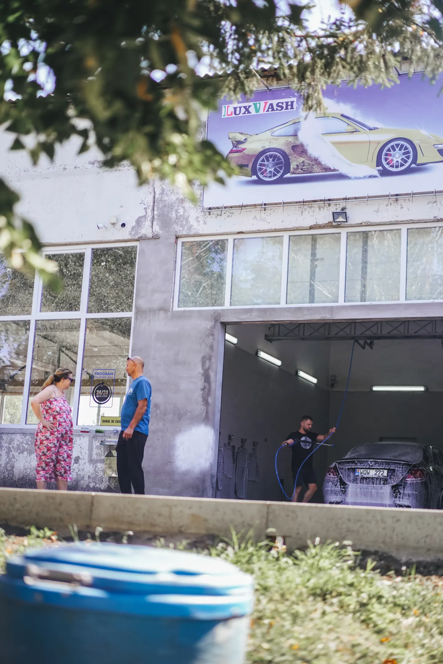 Anatolie Peancovschi in front of his car wash in Grigorauca, Moldova in August 2024