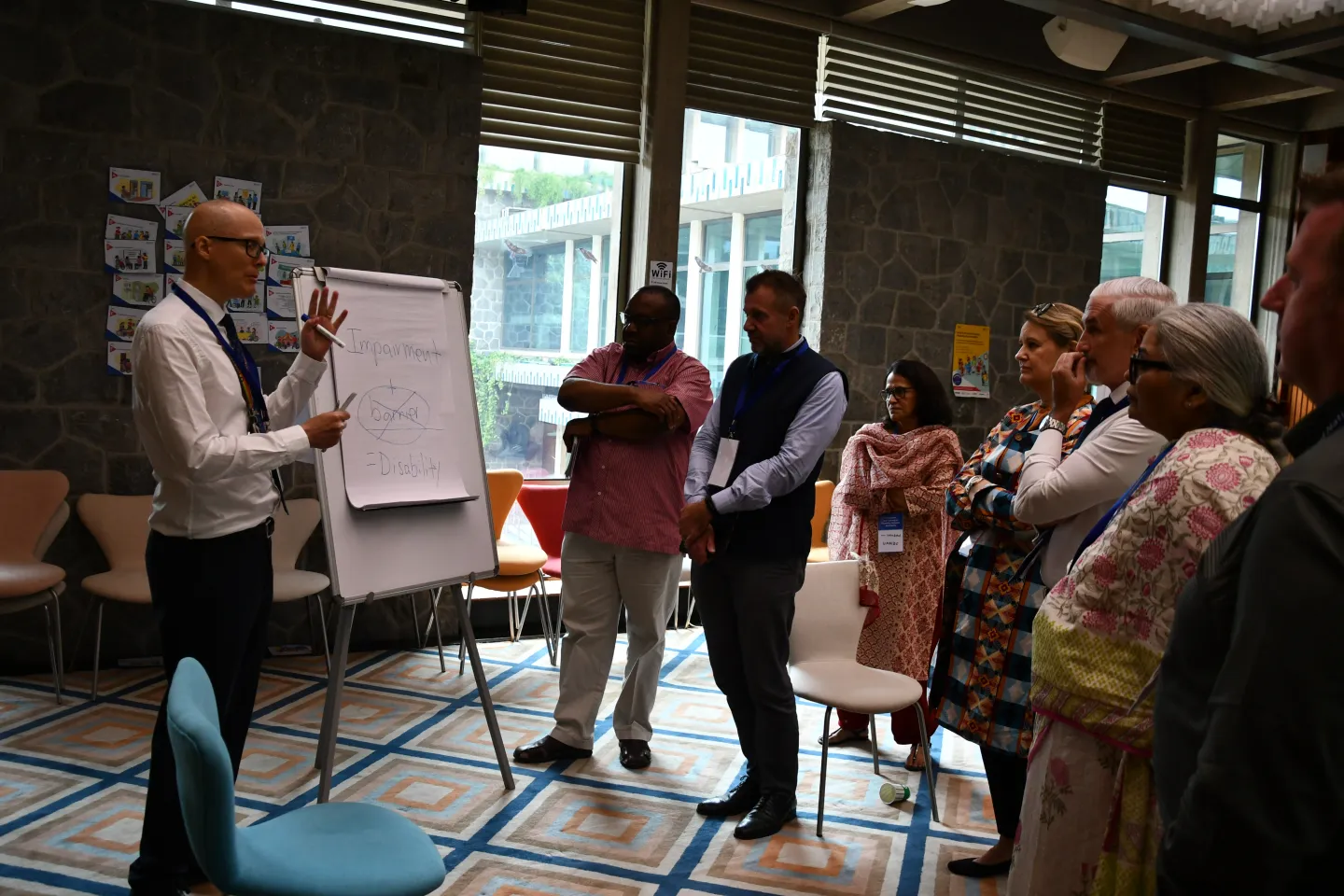 Men and women standing together in a conference room