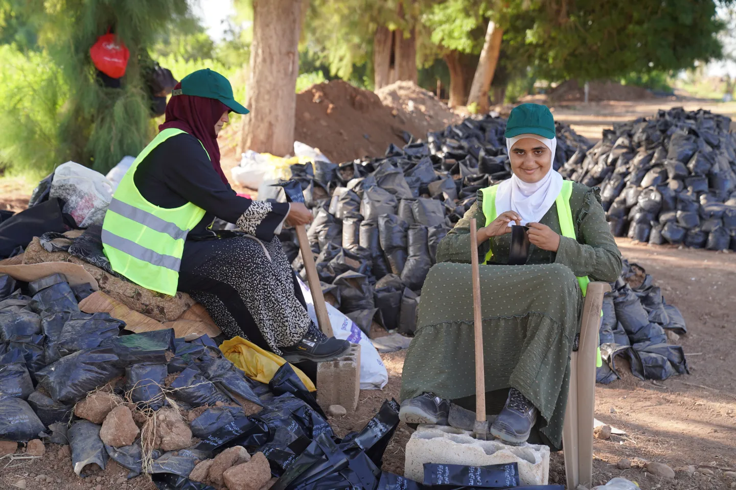 women workers, one whom is visually impaired , taking a break