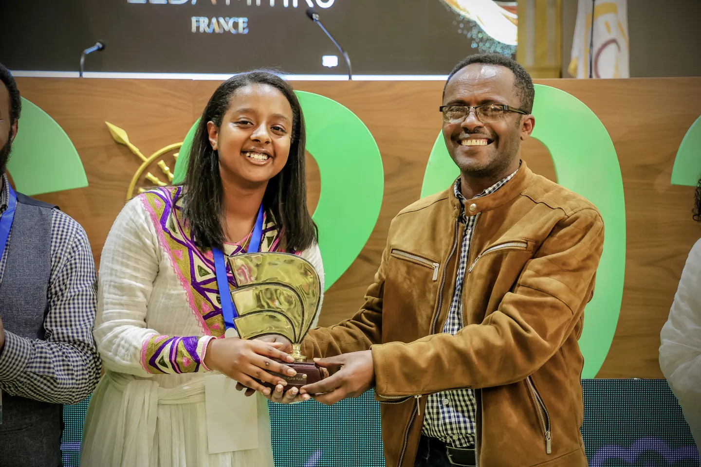 woman receiving award