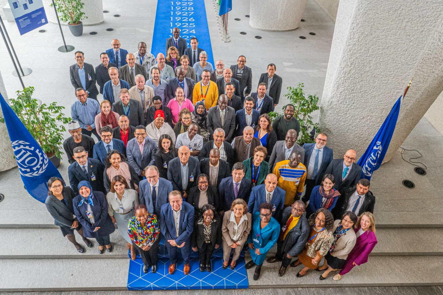 Group photo of participants in the technical meeting on the promotion of decent work and a just transition in the building materials industry, including cement