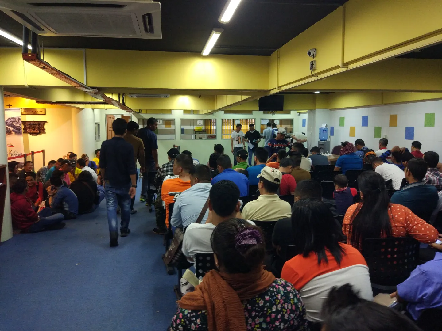Nepali migrant workers waiting their turn in Nepali Consular mission in Malaysia