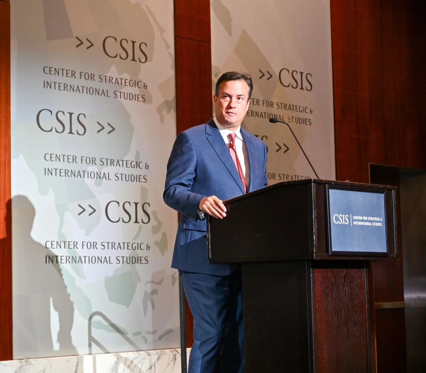 Man standing behind podium giving a speech