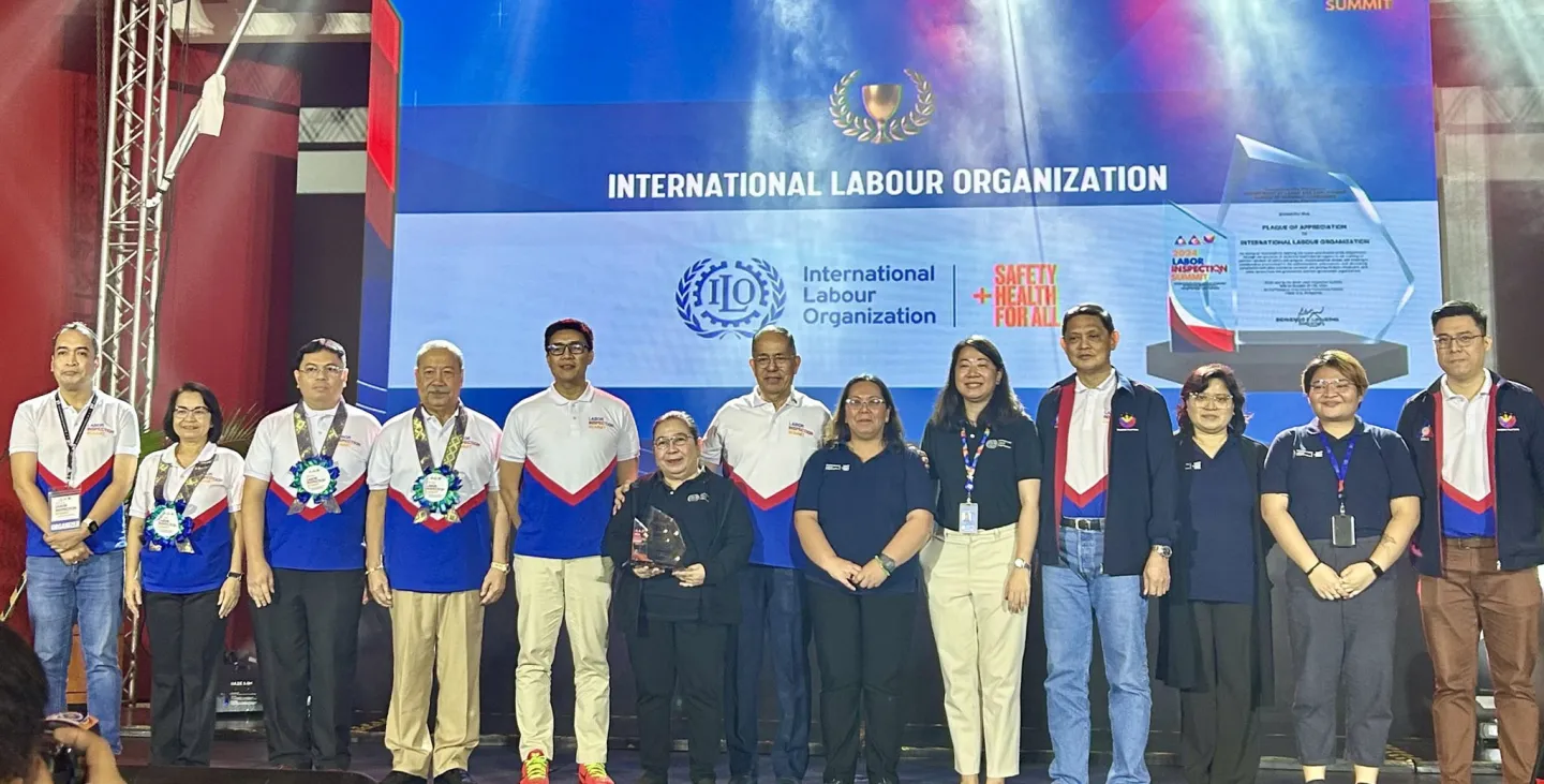 ILO receives an appreciation award on stage