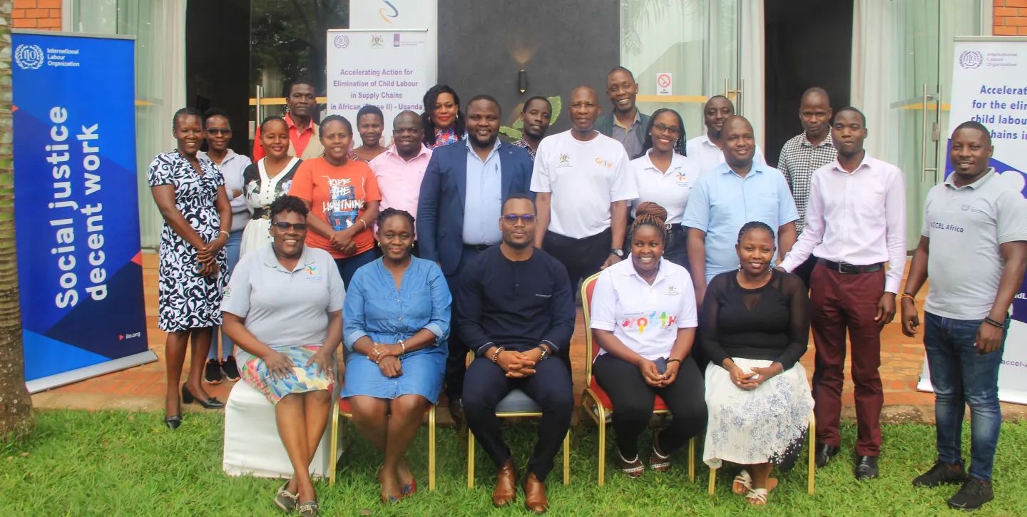 Labour inspector participants to an occupational safety and health training pose for a group picture