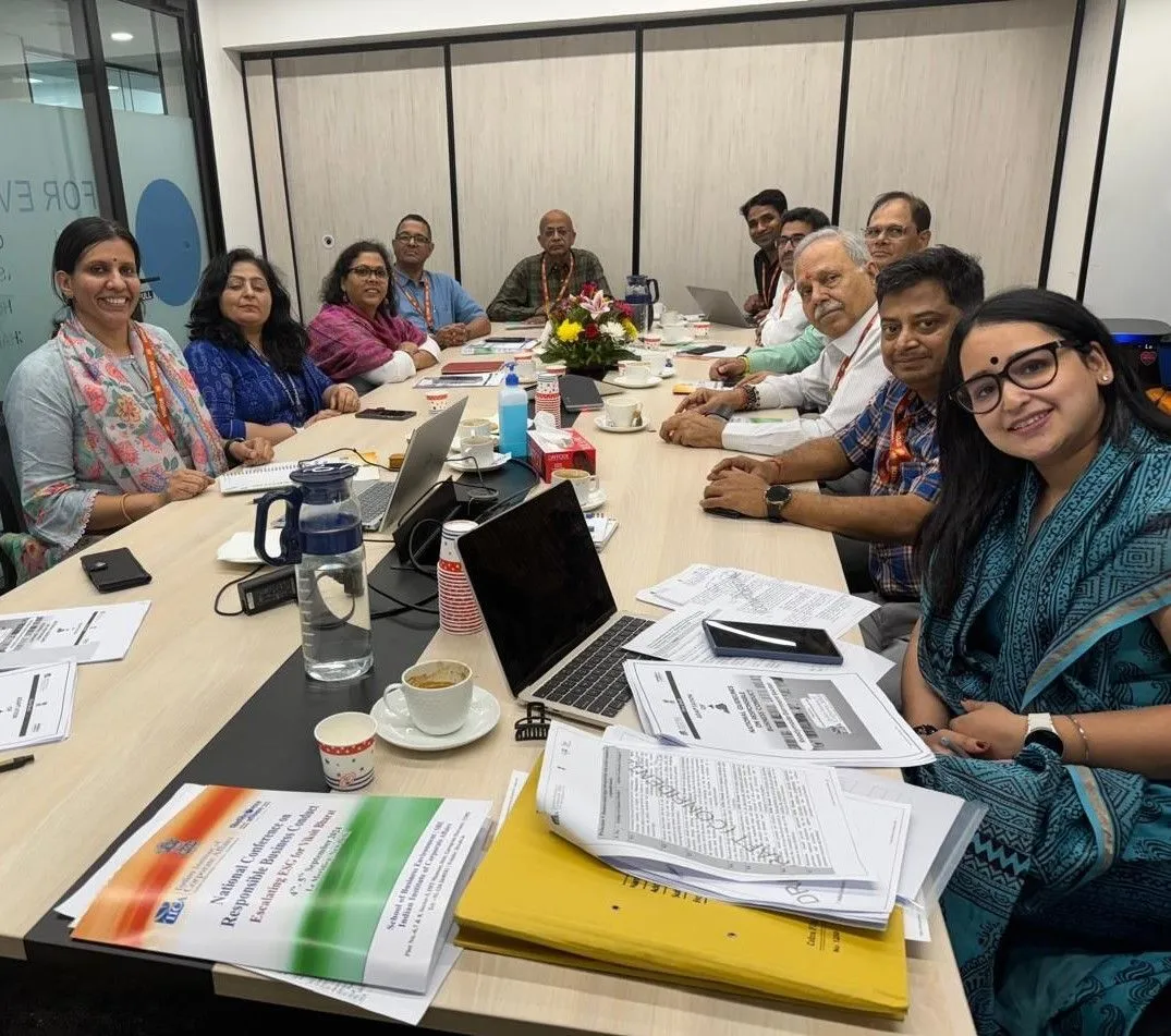 Women and men sitting together in a conference room
