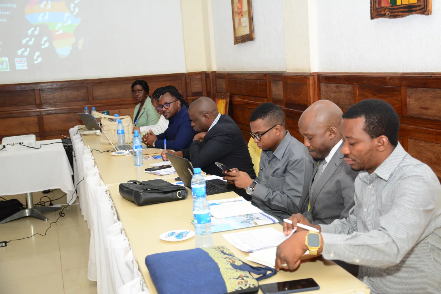 A row of meeting participants in meeting room.