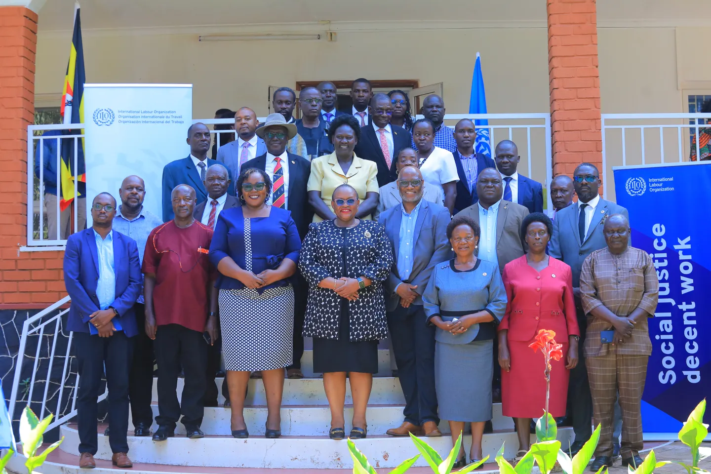 Group photo of partners with the Director of ILO CO Dar-es-Salaam