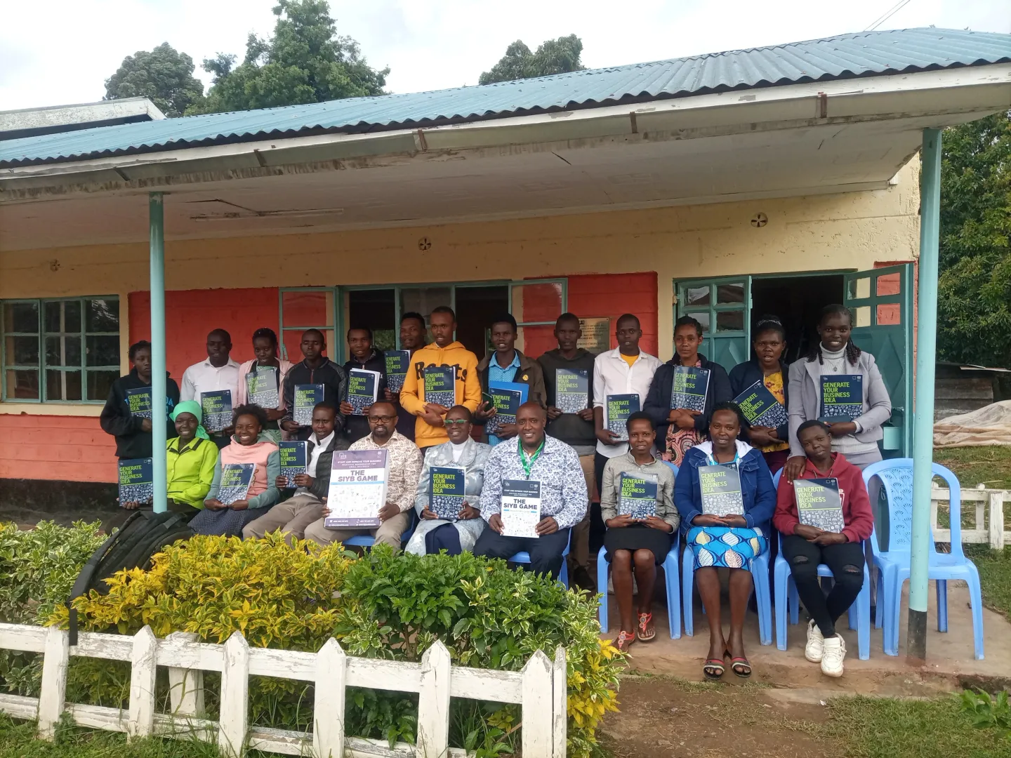 Certified SIYB trainers pose with their teaching materials