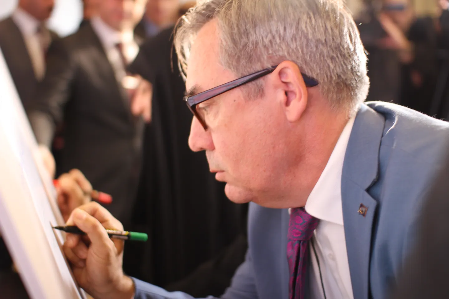 Head of Cooperation at the European Union Delegation to Iraq, Mr. Lennart Derider signing the commitment to support the national awareness campaign on the Social Security Law in Iraq