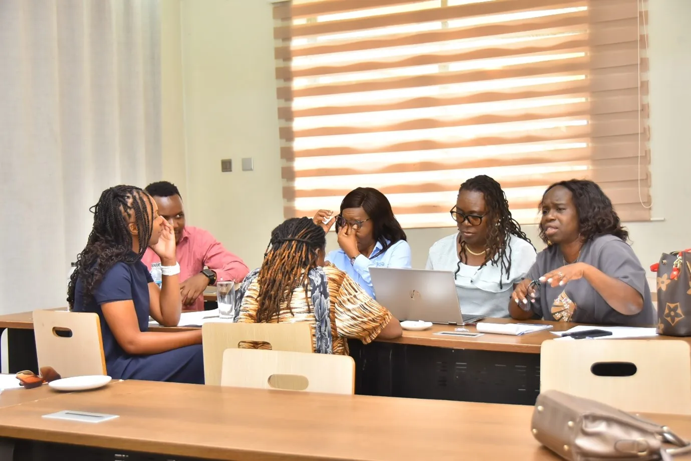 Women entrepreneurs discussing practical strategies to address challenges faced by women entrepreneurs in Malawi (ILO)
