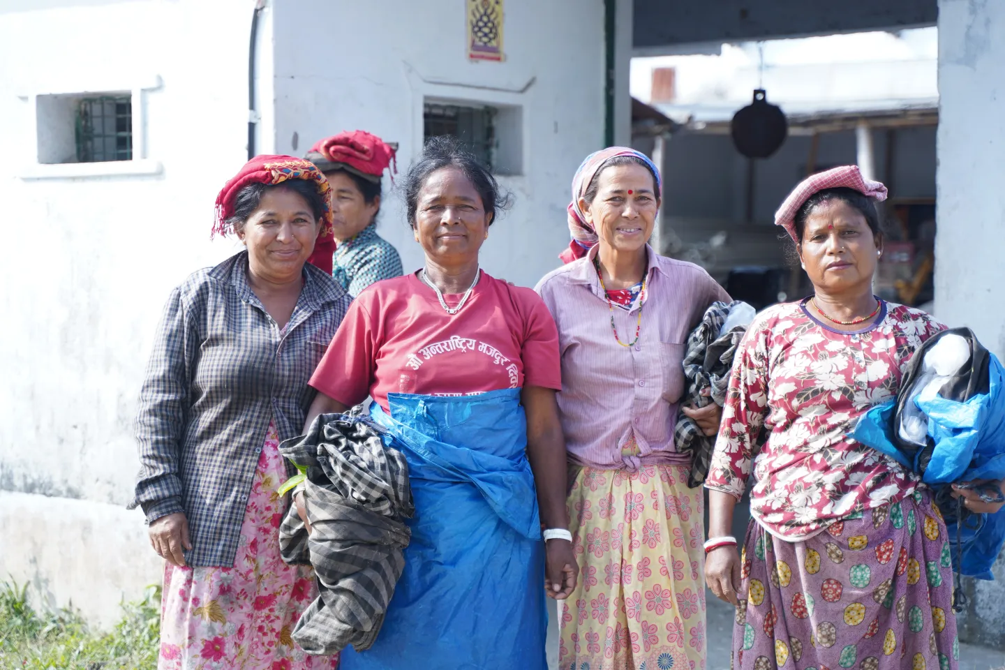 Group of women tea pluckers looking at the camera