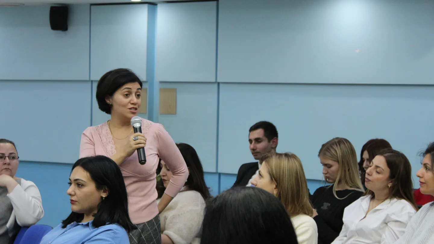 a woman with a mic speaks during the ILO-UNDP seminar initiated during 16 days against gender-based violence campaign