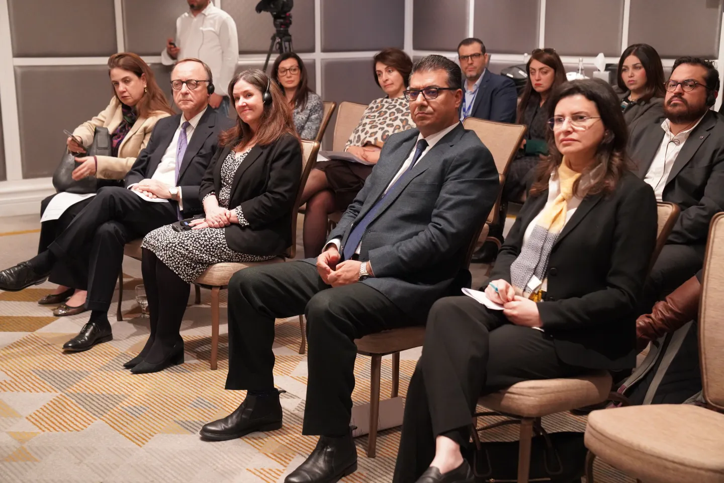 meeting participants sitting on chairs
