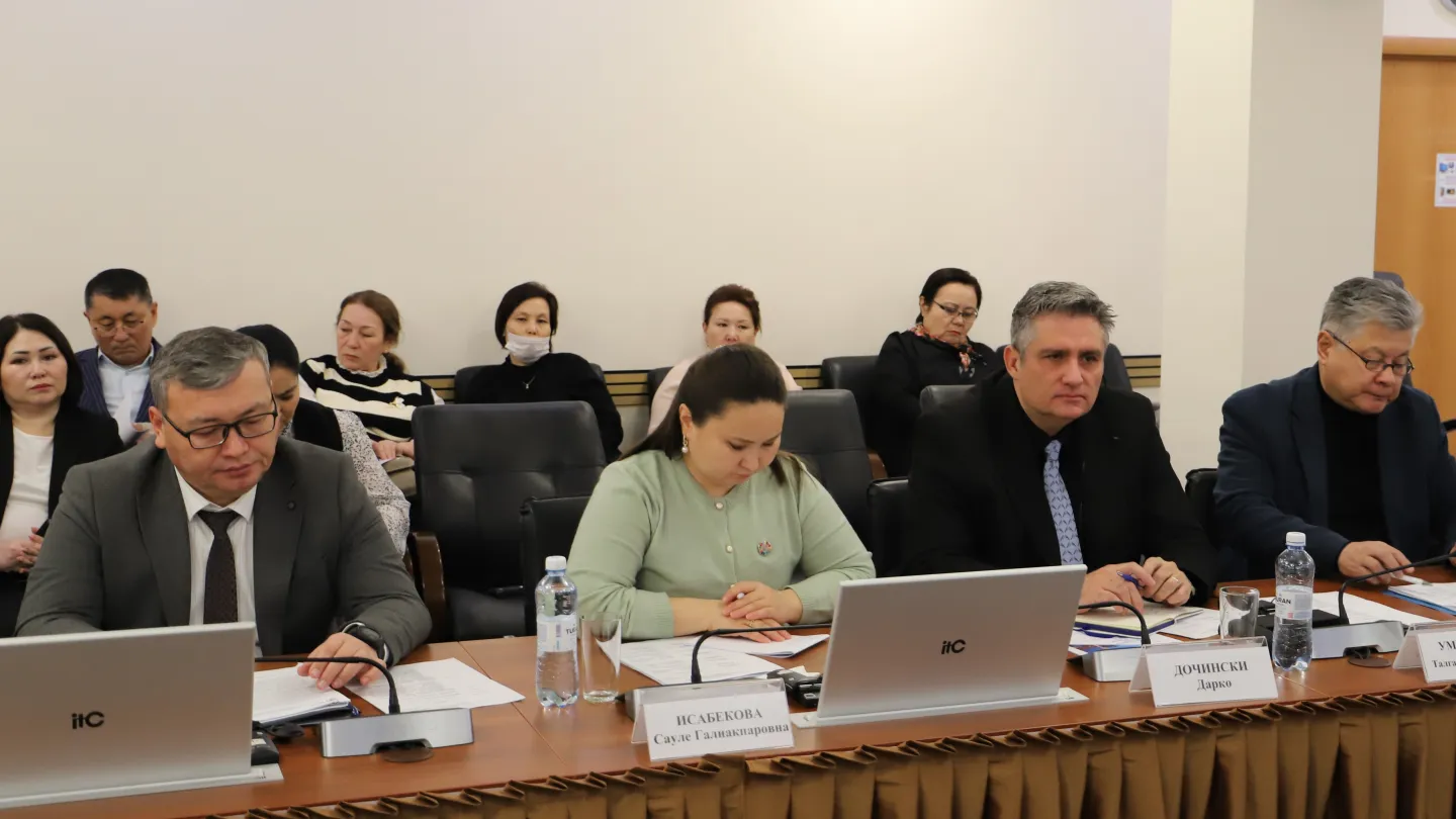 Group of people sitting at the table and behind them during the official launch roundtable for the RBSA project in Kazakhstan on 3 December 2024