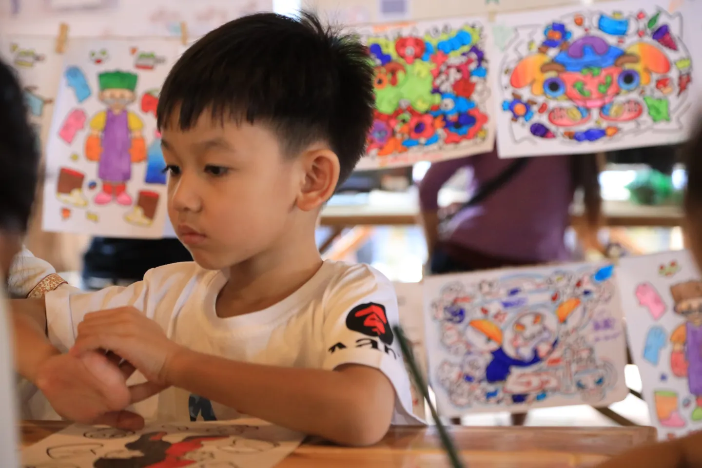 A boy is drawing.