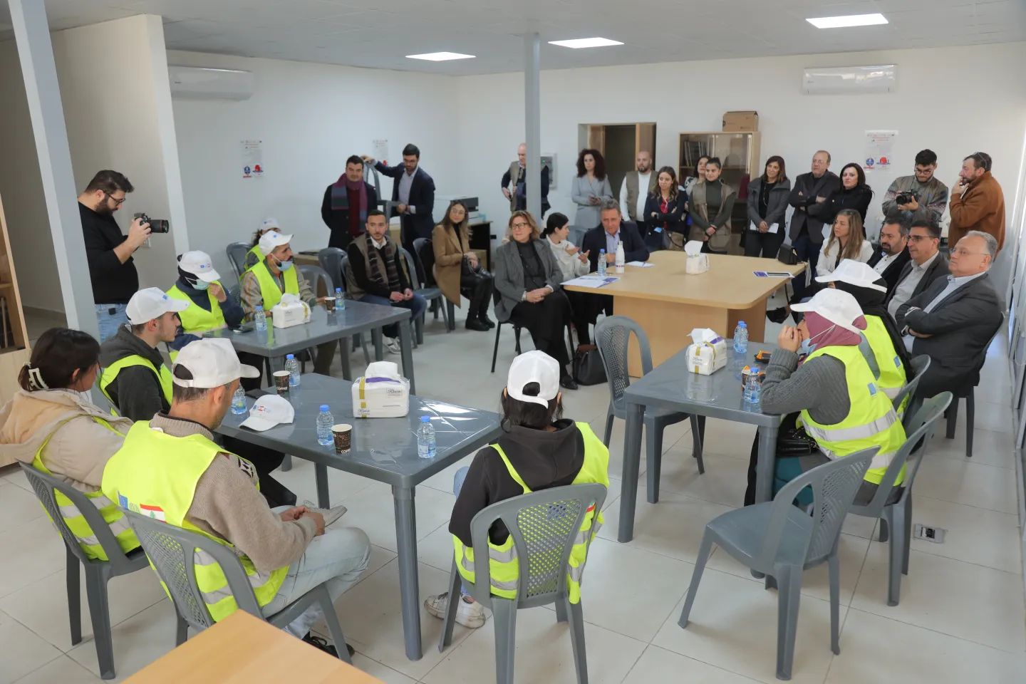 a group of beneficiaries sitting in a meeting room part of a discussion group session in Bourj Hammoud Lebanon